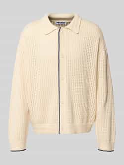 REVIEW Gebreid jack met polokraag en knoopsluiting