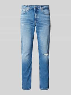 Calvin Klein Jeans Slim tapered fit jeans in destroyed-look