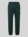 JACK & JONES Spodnie dresowe o kroju straight fit z mieszanki bawełny model 'Kane' Ciemnozielony