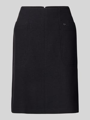 Knielange rok met steekzakken en labeldetail Shop The Look MANNEQUINE