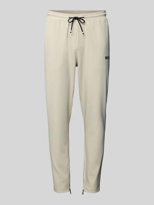 Spodnie dresowe o kroju regular fit z tunelem model ‘JT_TOC’ Shop The Look MANNEQUINE