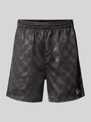 Relaxed Fit Shorts mit Allover-Logo-Print Modell 'Signature' Shop The Look MANNEQUINE