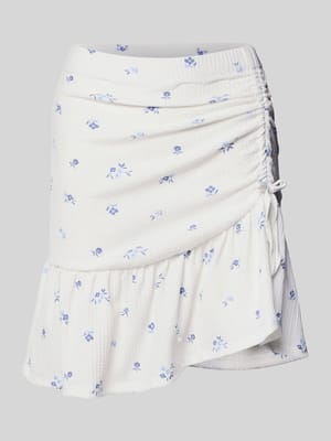 Ausgestellter Mini-Rock mit Allover-Muster Modell 'HILLARY' Shop The Look MANNEQUINE