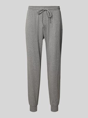Spodnie dresowe męskie JOOP! Collection;Mieszanka bawełny z dodatkiem streczu;Krój regular fit;Elastyczny pas;Tunel;Długość wewnętrzna nogawki w rozmiarze M: 74 cm Shop The Look MANNEQUINE
