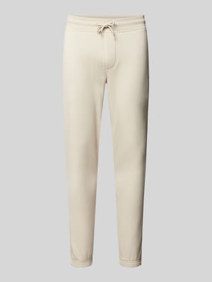 Slim fit sweatpants met labeldetail Shop The Look MANNEQUINE