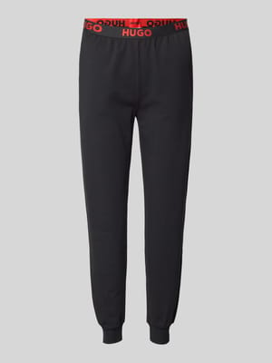 Relaxed Fit Sweatpants mit elastischem Label-Bund Modell 'SPORTY' Shop The Look MANNEQUINE