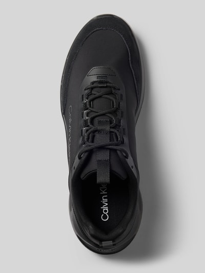 Productfoto, zwarte heren sneakers met leer, gladde textuur, model 'LIGHT EVA' van CK Calvin Klein, bovenaanzicht.