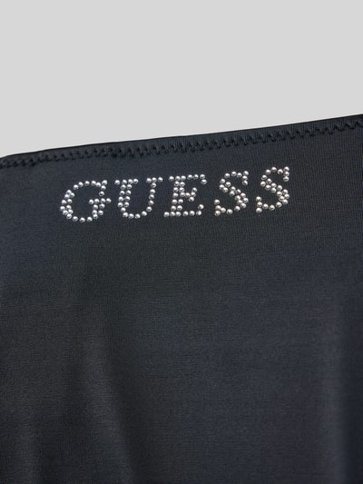 Produktfoto, Bikini-Hose mit Strasssteinbesatz Modell 'Violet' von Guess, czarny elastyczny materiał, logo z dżetami, damska bielizna plażowa