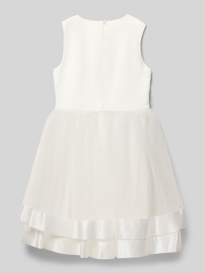 Dziewczynka nosi 'Kleid mit Tüll und rückseitigem Reißverschluss' od Guess, materiał z dodatkiem stretchu, A-linia, tiul, zamek z tyłu, długość pleców 76 cm, kolor biały, gładka faktura, satynowe wykończenie, całościowy widok z tyłu.