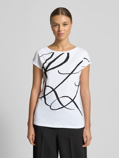Frauenmodel trägt Slim Fit T-Shirt mit Allover-Print Modell 'Grieta' von Lauren Ralph Lauren aus Baumwoll-Mix, Rundhalsausschnitt, Kurzärmelig, Ganzkörperansicht von vorne.
