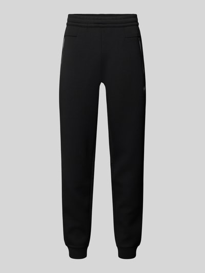 Produktfoto, schwarze Sweatpants mit gerader Passform, elastischem Bund und Reißverschlusstaschen, Modell 'TRAIN PREMIUM SHIELD' von EA7 Emporio Armani, Material-Mix mit Viskose-Anteil, gerippte Abschlüsse, Innenbeinlänge 78 cm