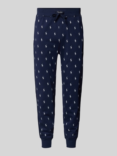 Productfoto, Sweathose mit Allover-Logo-Print van Polo Ralph Lauren, donkerblauw katoen, losse pasvorm, elastische taille, witte logo’s.