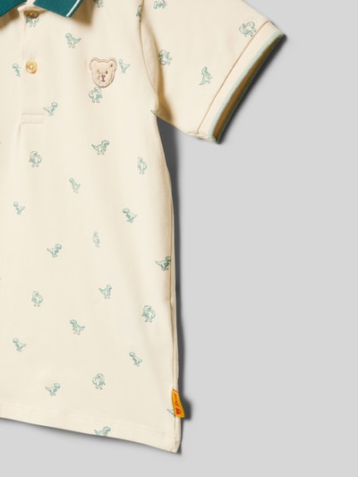 Produktfoto, Regular Fit Poloshirt mit Logo-Stitching von Steiff im elastischen Baumwoll-Mix, cremefarben mit grünem Allover-Motiv-Print und Polokragen