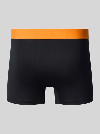 Produktfoto, Slim Fit Trunks mit Logo-Detail im 3er-Pack von Schiesser in Schwarz mit elastischem, orangefarbenem Bund, glatte Textur
