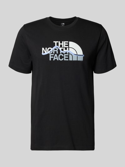 Productfoto, Regular Fit T-shirt van pure katoen model 'MOUNTAIN LINE' van The North Face in zwart met labelprint, ronde hals, ruglengte maat M 70 cm