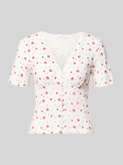 Produktfoto, Blusenshirt in Pointelle-Optik Modell 'Vianne' von OH APRIL aus Reine Baumwolle im eng anliegenden Schnitt mit V-Ausschnitt, Spitzenbesatz, Knopfleiste, Rückenlänge 33 cm bei Größe S, helle Grundfarbe mit zarten Punkten, dezente Struktur.