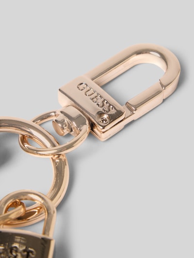 Productfoto, sleutelhanger met reliëflogo, Karabijnhaak, Model 'Melody', sleutelring, Dames sleutelhanger van Guess, gouden kleur, gladde metallic textuur