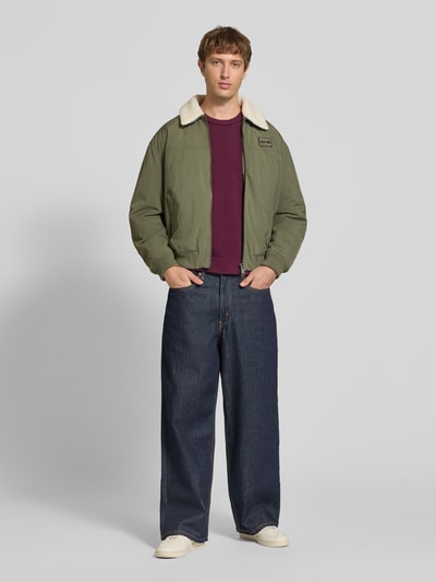 Tommy Jeans Regular Fit Bomberjacke mit abnehmbarem Teddy-Kragen Oliv 1
