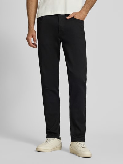 Männermodel trägt Slim Fit Jeans im 5-pocketmodel von G-Star Raw in zwart katoenmix met stretch, knoop- en ritssluiting, ganzkörperansicht von vorne.