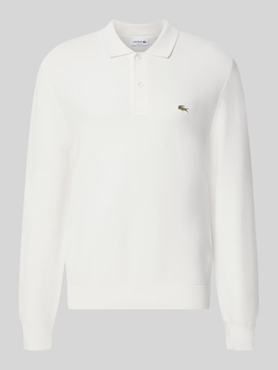 Produktfoto, weißes Regular Fit Poloshirt aus reiner Baumwolle von Lacoste, glatte Struktur, dezentes Logo, Herren Poloshirt von Lacoste