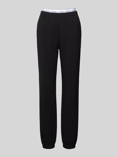 Produktfoto, spodnie dresowe Sweatpants mit elastischem Bund Model 'SOFIA' od GUESS, mieszanka bawełny, krój regular fit, czarne, długość wewnętrzna nogawki w rozmiarze S: 76 cm