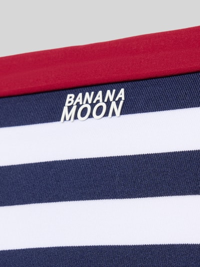Produktfoto, Bikinihose mit seitlicher Schnürung Modell 'SADIA NAVY' von Banana Moon im Allover-Look, navy-weiß gestreift, Material-Mix mit Stretch-Anteil, körpernahe Passform, rote Kante, strukturierte Oberfläche