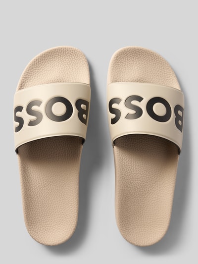 Productfoto, Badeschuhe mit Label-Prägung Modell 'ARYEH' van BOSS in effen kleuren met ronde punt van de schoen, platte hakvorm, gestructureerde zool, context: heren badeschoenen.