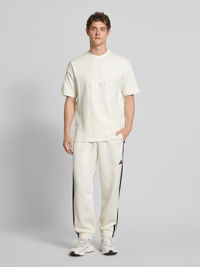 adidas Sportswear Relaxed fit sweatpants met logostitching, model 'Stadium' Offwhite - 1