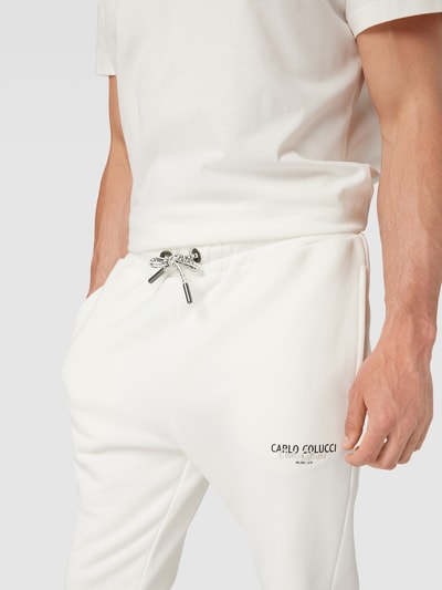 CARLO COLUCCI Spodnie dresowe z detalami z logo Złamany biały 3
