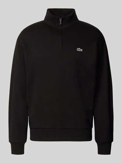 Produktfoto, schwarzer Regular Fit Troyer aus Baumwoll-Mix von Lacoste, glatte Oberfläche, dezentes Logo auf Brust, Herren Troyer von Lacoste