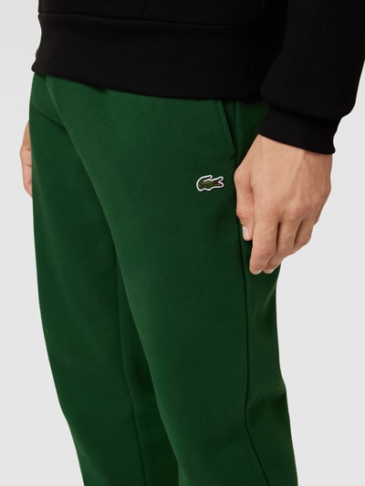 Lacoste Spodnie dresowe z detalem z logo Zielony 3