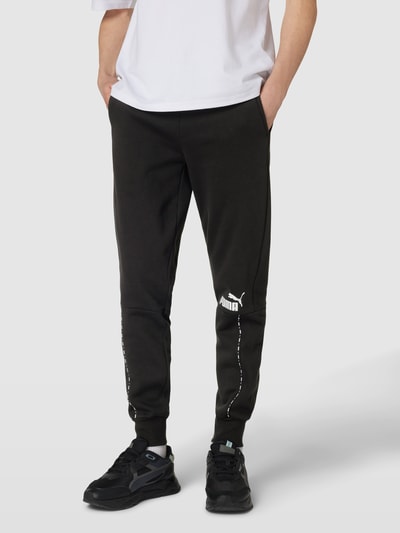 PUMA PERFORMANCE Sweatpants mit Label-Print Modell 'ESS BLOCK x TAPE' Black 4