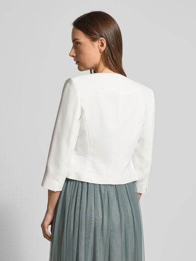Kobiece modelka nosi Bolerko z rękawem o dł. 1/2 od Christian Berg Cocktail, materiał odporny, krój tailored, jednokolorowy, długość tyłu 46 cm przy rozmiarze 36, widok od tyłu.