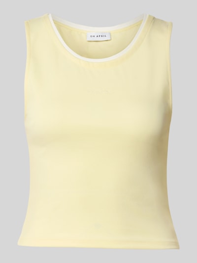 Produktfoto, tanktop in lichte geel, gladde stof met witte ronde hals, Laagjeslook, Model 'Eden' van OH APRIL, slim fit, ruglengte maat S 45 cm