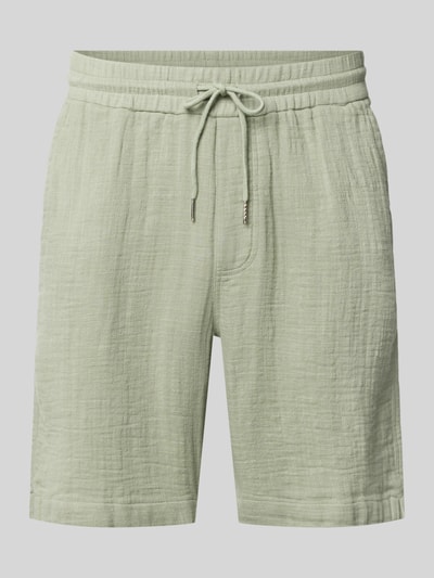 Produktfoto, Shorts mit Eingrifftaschen und elastischem Bund von Lindbergh z bawełny, krój loose fit, trok w pasie, szerokość w rozmiarze M 43 cm, długość wewnętrzna nogawki 22 cm, wpuszczane kieszenie, jasny zielony kolor, miękka tekstura