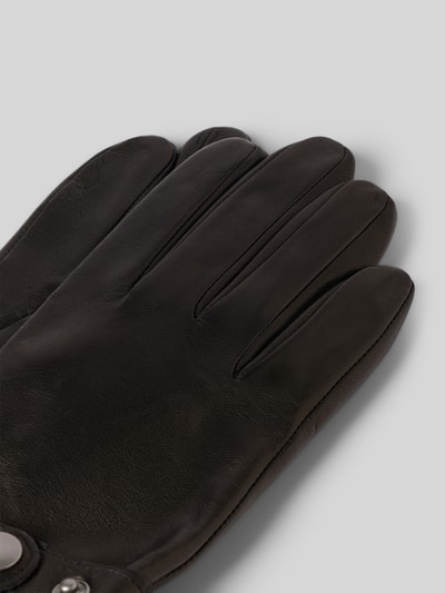 Produktfoto, Lederhandschuhe aus echtem Leder von Roeckl in Schwarz, glatte Oberfläche, Label-Detail in metallic, verstellbarer Riegel mit Druckknopfverschluss, Fingerhandschuhe