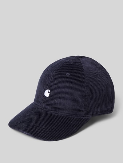 Produktfoto, Basecap mit Label-Stitching von Carhartt Work In Progress aus reiner Baumwolle mit verstärktem Schirm, eingestickten Luftlöchern und verstellbarem Verschluss in dunkelblauer Cord-Optik auf neutralem Hintergrund.