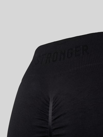 Stronger Legginsy sportowe z nadrukiem z logo Czarny 2