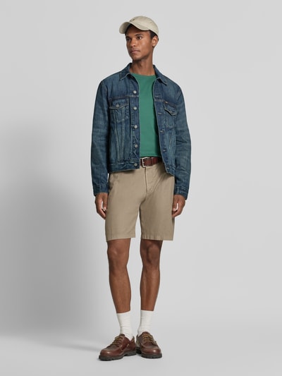 Mannenmodel draagt donkerblauwe Regular Fit jeansjack uit puur katoen model 'ICON' van Polo Ralph Lauren, Ganzkörperansicht von vorne.