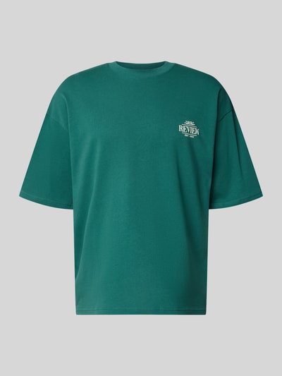 Produktfoto, Oversized T-Shirt mit rückseitigem Print von REVIEW in Grün mit Rundhalsausschnitt, Bio-Baumwoll-Mix, Logo-Print vorne.