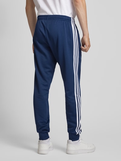 adidas Originals Slim fit sweatpants met labelstitching Marineblauw - 5