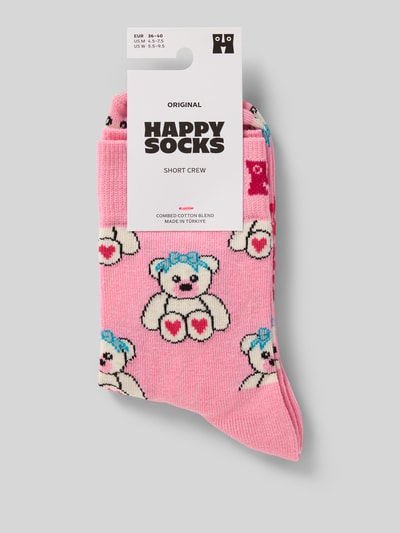 Produktfoto, Socken aus Baumwoll-Mix Modell 'TEDDY' von Happy Socks, rosa Grundfarbe mit bunten Teddybär-Motiven, Label-Detail sichtbar.