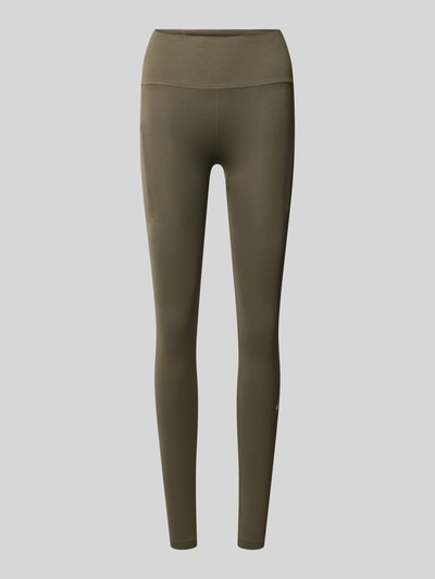 Produktfoto, olivgrüne Slim Fit Leggings mit Logo-Print von ASICS, elastischer Bund, Struktur-Partien, glatte Textur, Damen Leggings.