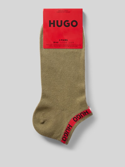 Produktfoto, Socken aus Baumwoll-Mix von HUGO in Khaki mit HUGO-Logo in Rot am Bund, glatte Textur, Herren Socken von HUGO