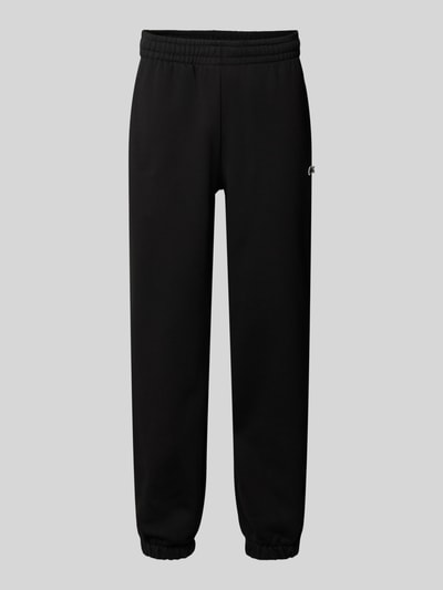 Produktfoto, schwarze Regular Fit Sweathose aus Baumwoll-Mix von Lacoste, Herren Sweathose, elastischer Bund und Beinabschluss, glatte Textur.