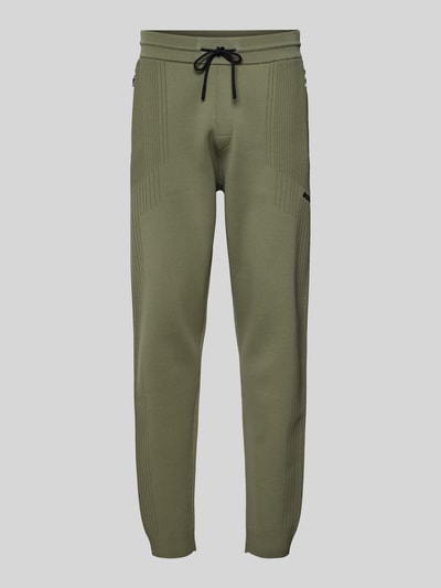 Produktfoto, Regular Fit Spodnie dresowe z żakardowymi akcentami Model 'ACTIVE PUSH' od BOSS Green, jednokolorowe, detal z logo, tunel, elastyczny ściągacz, boczne kieszenie na zamek, drobny splot.