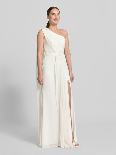 Vrouwenmodel draagt one-shoulder maxi-jurk van Unique, chiffon, recht model, stitchings, pailletten, parels, ruglengte maat 36: 144 cm, borstwijdte maat 36: 34 cm, one-shoulder look, vooraanzicht volledige lichaamsopname.