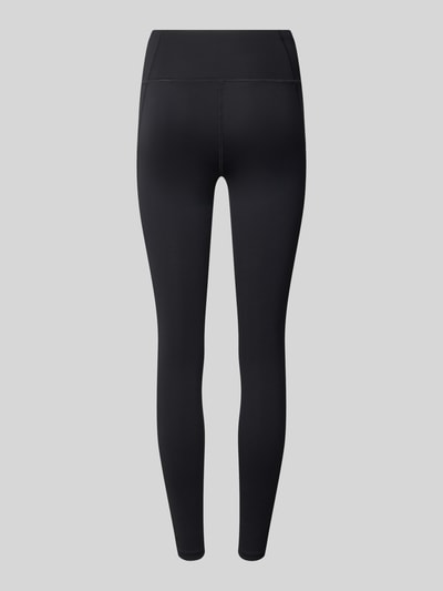 Produktfoto, czarne legginsy z elastyczną mieszanką materiałów, krój skinny fit, elastyczny pas, nadruk z logo, Leggings mit Stretch-Anteil Modell 'CORE' od ASICS TIGER