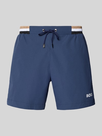 Produktfoto, Badeshorts mit Label-Schriftzug Modell 'ATOLL' van BOSS in uni blauw, regular fit, met tunnelkoord, elastische tailleband, achterzak, steekzakken, gladde textuur