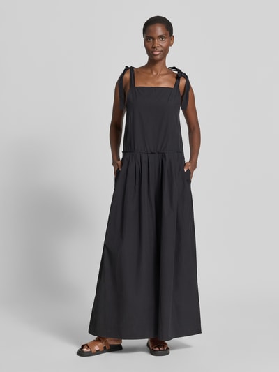 Modelka kobieca nosi Loose Fit Jumpsuit aus reiner Baumwolle Modell 'AGGUATI' von Weekend Max Mara, efekt: jednolity kolor, krój w kształcie litery a, wysokie zapięcie, zapięcie: zamek błyskawiczny, wiązanie na szyi, wpuszczane kieszenie, materiał: bawełna, całopostaciowy widok z przodu.